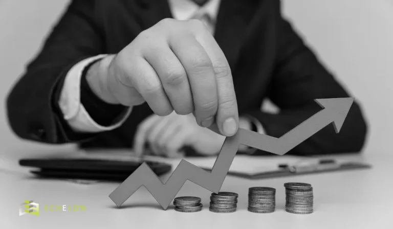 A person in a suit holds an upward-moving arrow above stacked coins, symbolizing capital gains tax implications on a business sale.