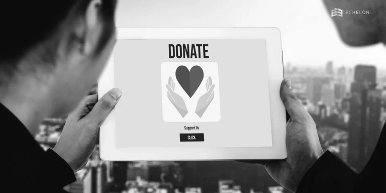 Two people holding a tablet with a "Donate" screen featuring a heart and hands, highlighting donor advised fund tax deduction opportunities.