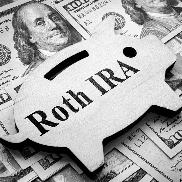 Piggy bank silhouette labeled "Roth IRA" rests on a background of hundred-dollar bills, illustrating Roth IRA conversion rules.